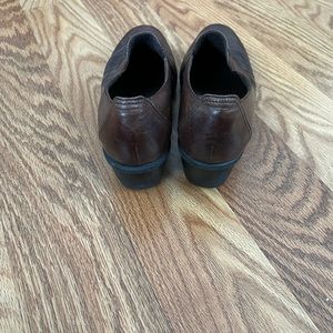 Brown leather shoes by Clark’s with a wedge heel. Very comfortable. Size 9.